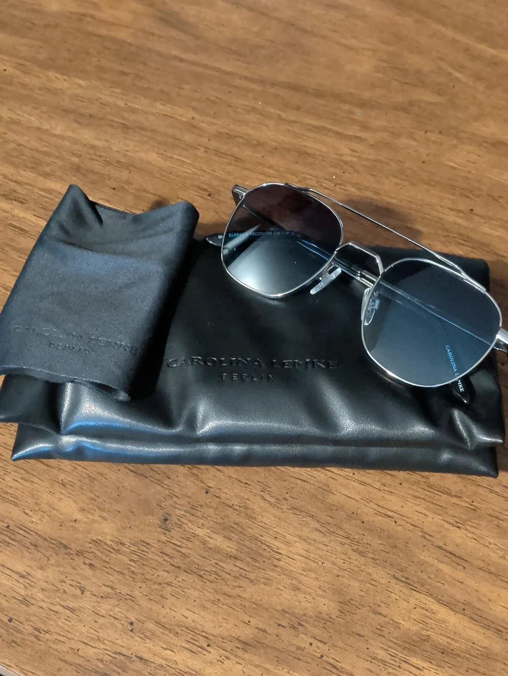 Carolina Lemke Berlin Men’s Silver Frame Sunglasses with Blue Lenses